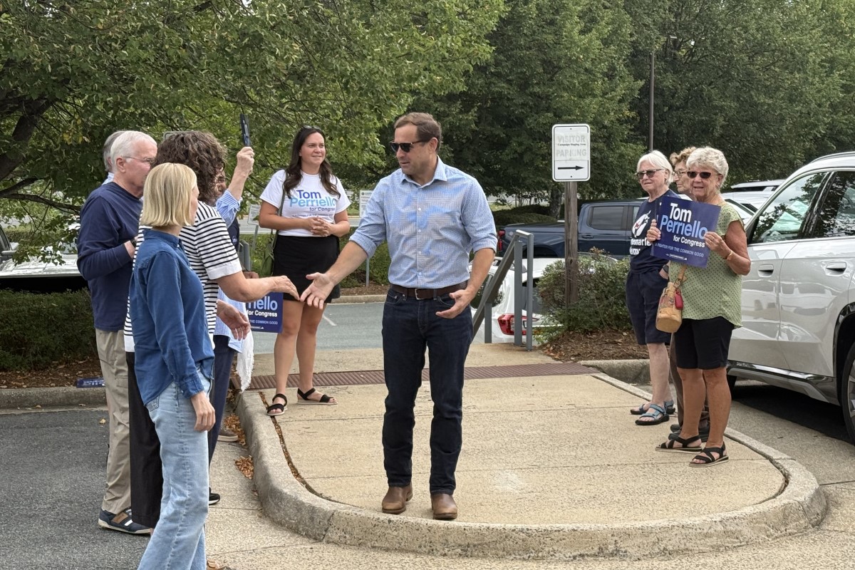 Tom Perriello greets supporters while early voting