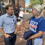 Tom Perriello speaks with retired letter carrier Cindy Connors.
