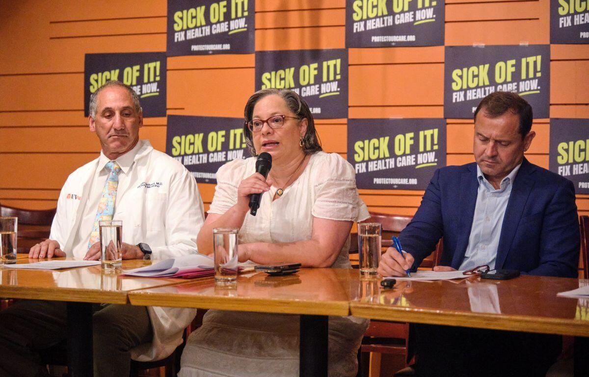 Rep. Jennifer McClellan, Tom Perriello, and Dr. Mohan Nadkarni speak at the Sick of It! healthcare campaign tour in Charlottesville.