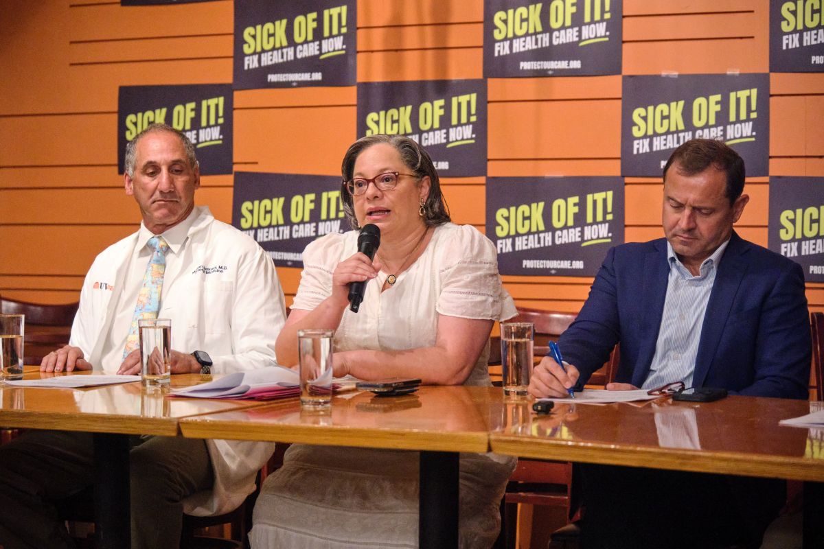 Rep. Jennifer McClellan, Tom Perriello, and Dr. Mohan Nadkarni speak at the Sick of It! healthcare campaign tour in Charlottesville.