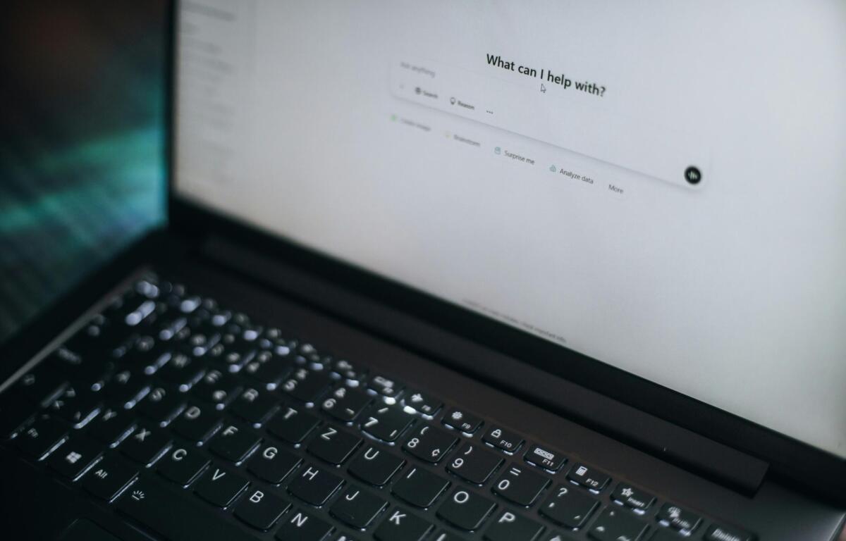 laptop with the screen open to an ai chatbot