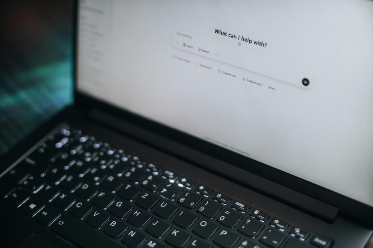 laptop with the screen open to an ai chatbot
