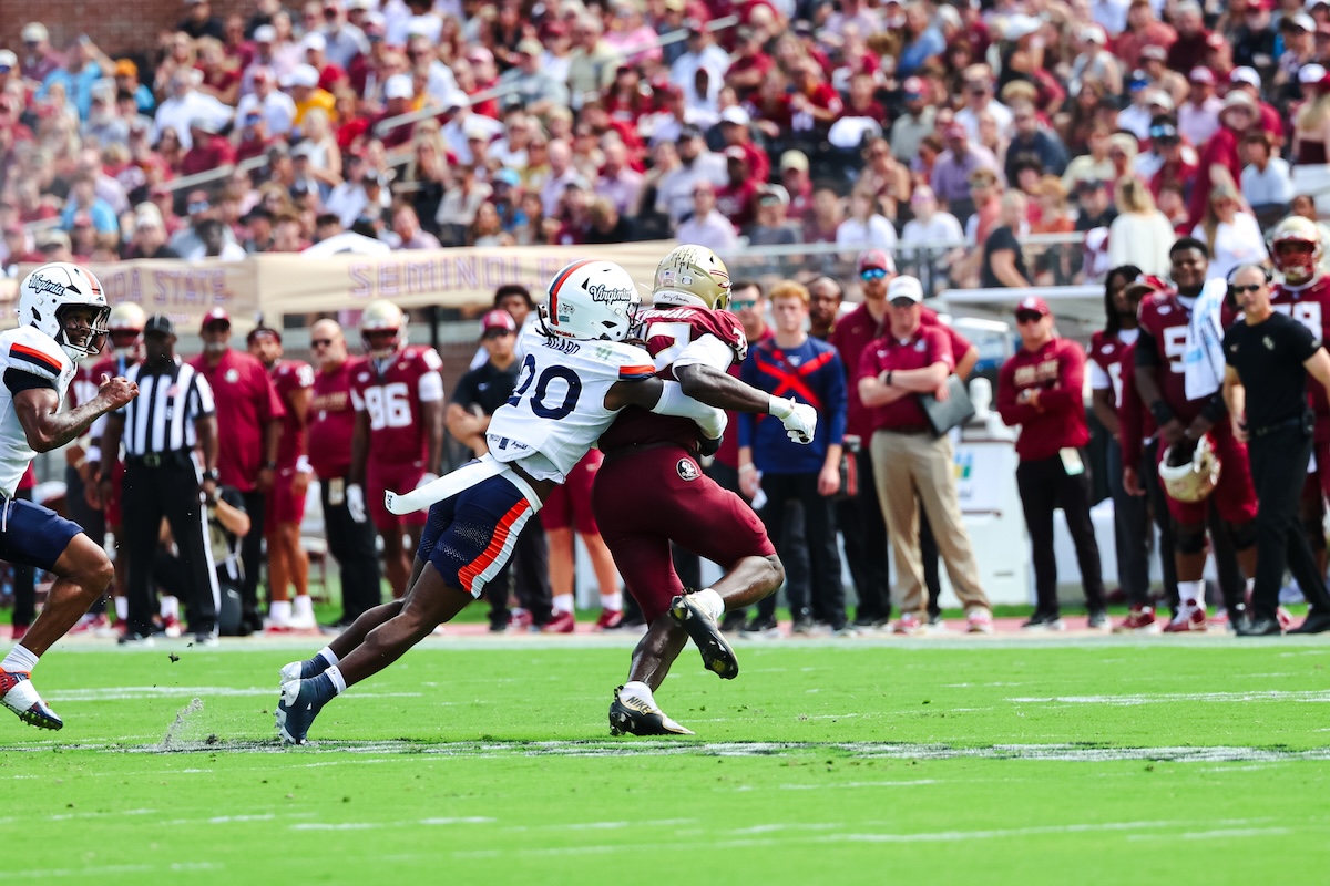 UVA's Omillio Agard tackles Ousmane Kromah.