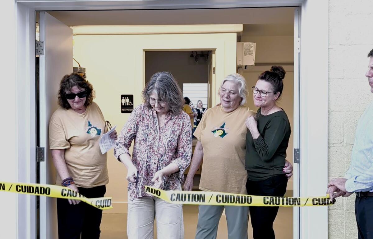 Feeding Greene backpack ribbon cutting