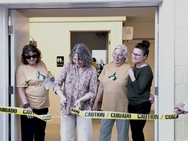 Feeding Greene backpack ribbon cutting