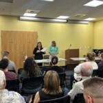 Albemarle School Board Members Judy Le (back left) and Rebecca Berlin (back right) at Tuesday's town hall.