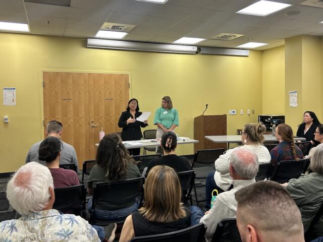 Albemarle School Board Members Judy Le (back left) and Rebecca Berlin (back right) at Tuesday's town hall.
