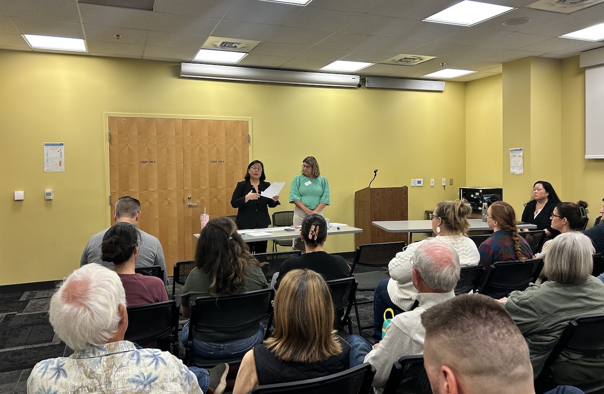 Albemarle School Board Members Judy Le (back left) and Rebecca Berlin (back right) at Tuesday's town hall.